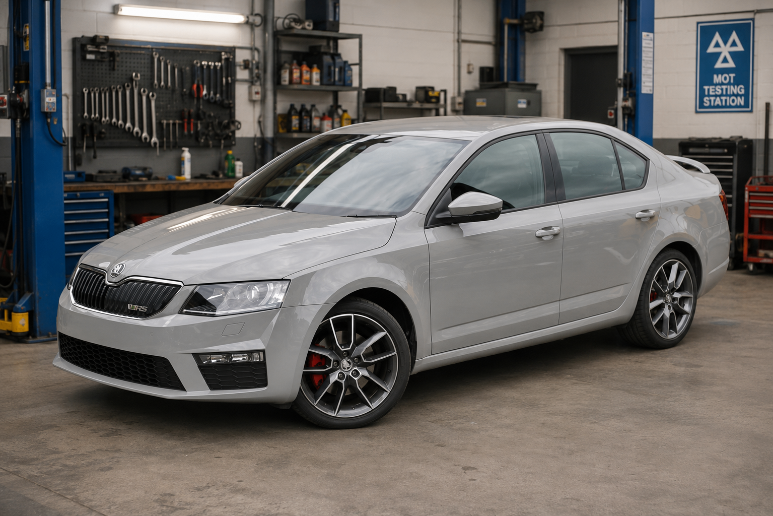 Škoda Octavia VRS hatch beside the two-post lift